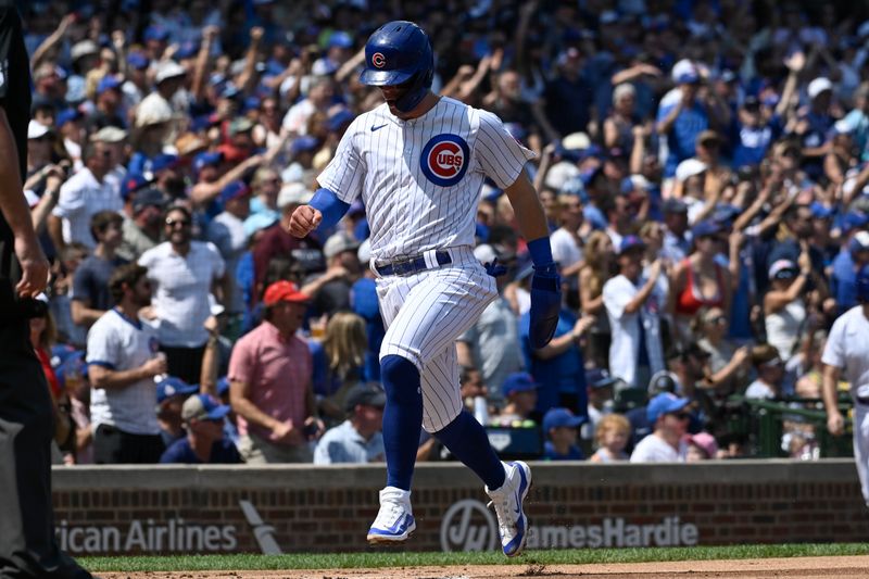 Aug 20, 2023; Chicago, Illinois, USA;  Chicago Cubs second baseman Nico Hoerner (2) scores against the Kansas City Royals during the first inning at Wrigley Field. Mandatory Credit: Matt Marton-USA TODAY Sports