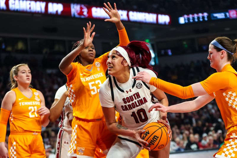 Mar 3, 2024; Columbia, South Carolina, USA; South Carolina Gamecocks center Kamilla Cardoso (10) drives past Tennessee Lady Vols forward Jillian Hollingshead (53) in the first half at Colonial Life Arena. Mandatory Credit: Jeff Blake-USA TODAY Sports