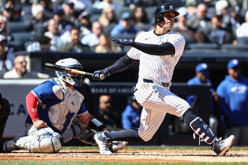 Apr 7, 2024; Bronx, New York, USA; New York Yankees right fielder Juan Soto (22) hits a single in the third inning against the Toronto Blue Jays at Yankee Stadium. Mandatory Credit: Wendell Cruz-USA TODAY Sports