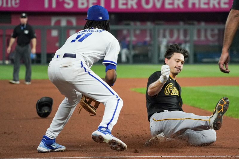 Aug 29, 2023; Kansas City, Missouri, USA; Kansas City Royals designated hitter MJ Melendez (1) misses the tag as Pittsburgh Pirates left fielder Bryan Reynolds (10) reaches third base for a triple in the ninth inning at Kauffman Stadium. Mandatory Credit: Denny Medley-USA TODAY Sports