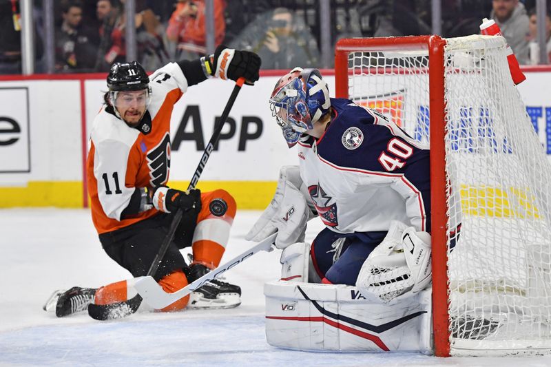 Jan 4, 2024; Philadelphia, Pennsylvania, USA; Columbus Blue Jackets goaltender Daniil Tarasov (40) makes a save against Philadelphia Flyers right wing Travis Konecny (11) during the first period at Wells Fargo Center. Mandatory Credit: Eric Hartline-USA TODAY Sports