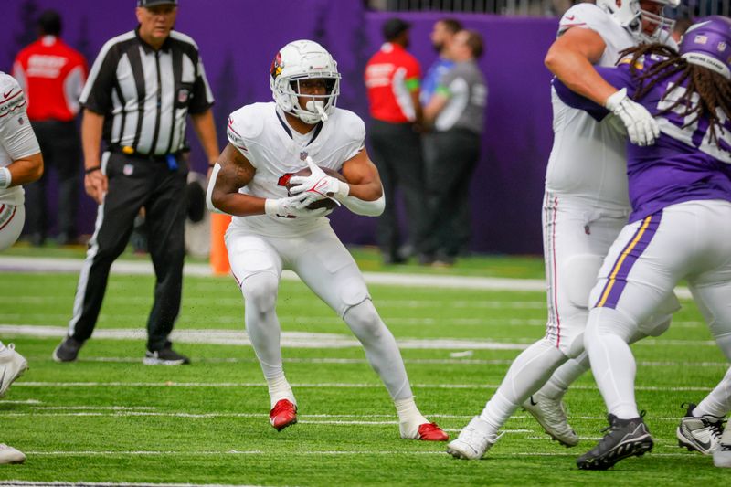 Arizona Cardinals running back Emari Demercado (31) runs the ball against the Minnesota Vikings during the first half of an NFL preseason football game, Saturday, Aug. 26, 2023, in Minneapolis. (AP Photo/Bruce Kluckhohn)