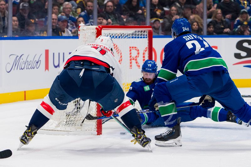 Mar 16, 2024; Vancouver, British Columbia, CAN; Vancouver Canucks defenseman Filip Hronek (17) and forward Pius Suter (24) watch as Washington Capitals forward Alex Ovechkin (8) scores on the Vancouver goal in the second period at Rogers Arena. Mandatory Credit: Bob Frid-USA TODAY Sports