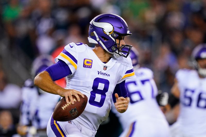 Minnesota Vikings quarterback Kirk Cousins (8) looks to pass during the first half of an NFL football game against the Philadelphia Eagles, Monday, Sept. 19, 2022, in Philadelphia. (AP Photo/Matt Slocum)