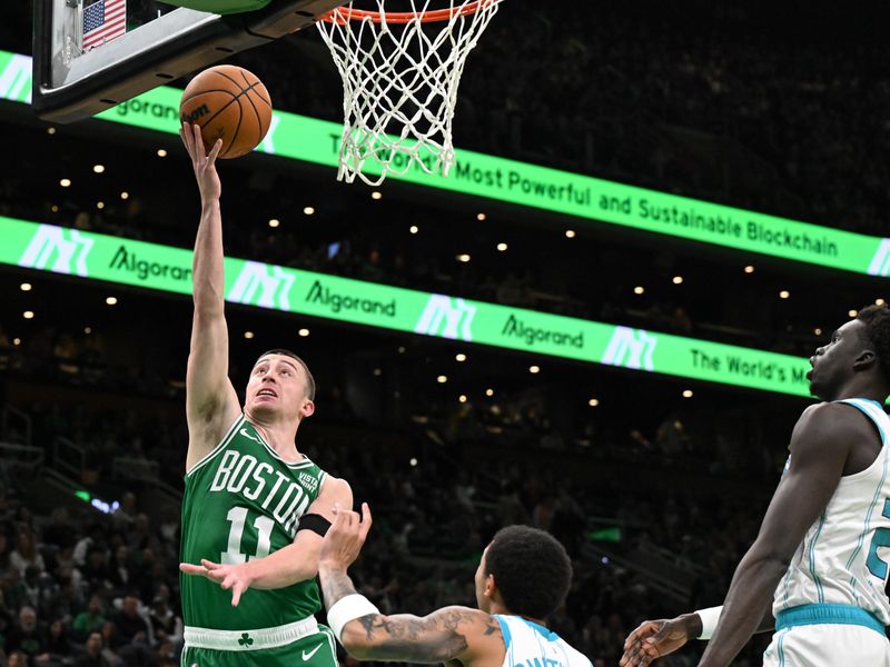 BOSTON, MASSACHUSETTS - APRIL 12: Payton Pritchard #11 of the Boston Celtics attempts a layup against the Charlotte Hornets during the first quarter at the TD Garden on April 12, 2024 in Boston, Massachusetts. NOTE TO USER: User expressly acknowledges and agrees that, by downloading and or using this photograph, User is consenting to the terms and conditions of the Getty Images License Agreement. (Photo by Brian Fluharty/Getty Images)