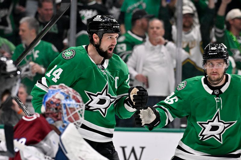 Mar 6, 2026; Dallas, Texas, USA; Dallas Stars left wing Jamie Benn (14) and defenseman Ilya Lyubushkin (46) celebrates a goal scored by Benn against Colorado Avalanche goaltender MacKenzie Blackwood (39) during the second period at the American Airlines Center. Mandatory Credit: Jerome Miron-Imagn Images