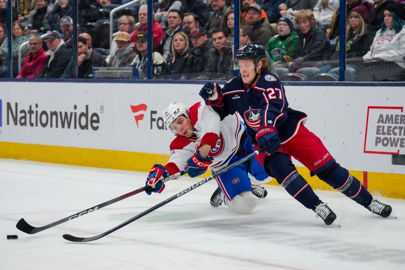 Nov 29, 2023; Columbus, Ohio, USA;  Montreal Canadiens center Jake Evans (71) skates for the puck against Columbus Blue Jackets defenseman Adam Boqvist (27) in the first period at Nationwide Arena. Mandatory Credit: Aaron Doster-USA TODAY Sports