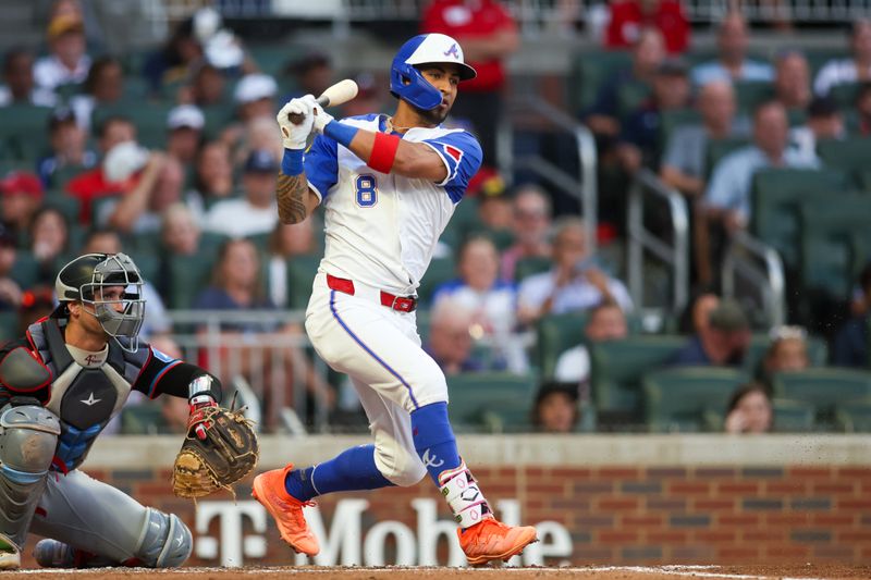 Aug 3, 2024; Atlanta, Georgia, USA; Atlanta Braves left fielder Eddie Rosario (8) drives in a run on a ground out against the Miami Marlins in the third inning at Truist Park. Mandatory Credit: Brett Davis-USA TODAY Sports
