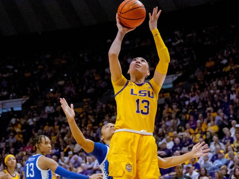 Mar 3, 2024; Baton Rouge, Louisiana, USA; LSU Lady Tigers guard Last-Tear Poa (13) shoots against Kentucky Wildcats guard Brooklynn Miles during the second half at Pete Maravich Assembly Center. Mandatory Credit: Matthew Hinton-USA TODAY Sports