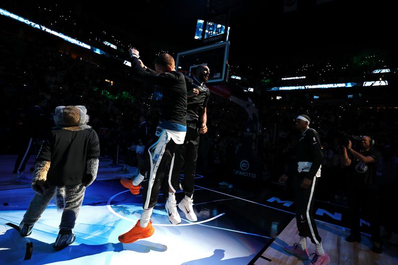 MINNEAPOLIS, MN - NOVEMBER 17: Rudy Gobert #27 and Donte DiVincenzo #0 of the Minnesota Timberwolves jump before the game against the Phoenix Suns on November 17, 2024 at Target Center in Minneapolis, Minnesota. NOTE TO USER: User expressly acknowledges and agrees that, by downloading and or using this Photograph, user is consenting to the terms and conditions of the Getty Images License Agreement. Mandatory Copyright Notice: Copyright 2024 NBAE(Photo by David Sherman/NBAE via Getty Images)