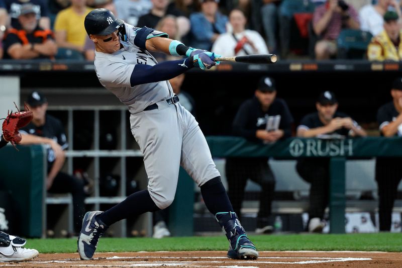 Aug 12, 2024; Chicago, Illinois, USA; New York Yankees outfielder Aaron Judge (99) hits a RBI double against the Chicago White Sox during the first inning at Guaranteed Rate Field. Mandatory Credit: Kamil Krzaczynski-USA TODAY Sports