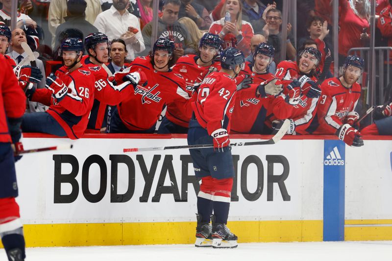 Apr 28, 2024; Washington, District of Columbia, USA; Washington Capitals defenseman Martin Fehervary (42) celebrates with teammates after scoring a goal against the New York Rangers in the first period in game four of the first round of the 2024 Stanley Cup Playoffs at Capital One Arena. Mandatory Credit: Geoff Burke-USA TODAY Sports