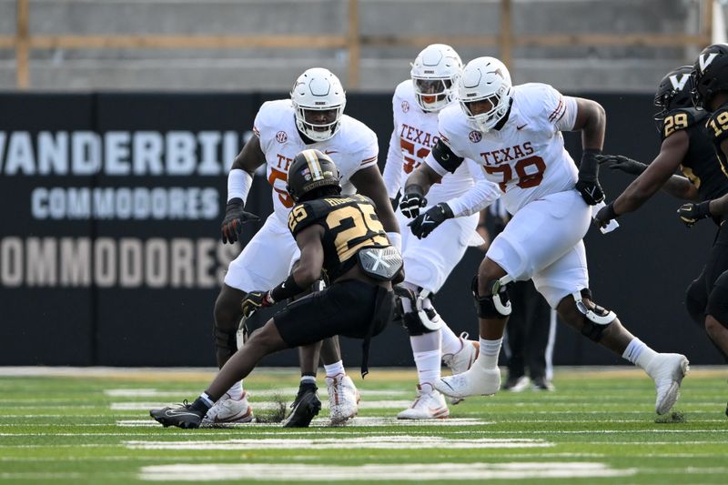 Oct 26, 2024; Nashville, Tennessee, USA;  Texas Longhorns offensive lineman Kelvin Banks Jr. (78) and offensive lineman Cameron Williams (56) tackle Vanderbilt Commodores cornerback Martel Hight (25) after an interception during the first half at FirstBank Stadium. Mandatory Credit: Steve Roberts-Imagn Images