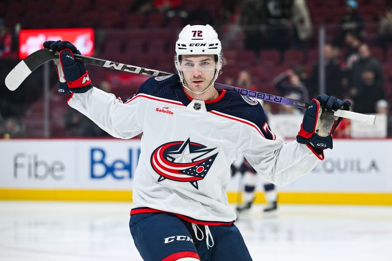 Mar 12, 2024; Montreal, Quebec, CAN; Columbus Blue Jackets right wing Carson Meyer (72) stretches with the help of a stick on his shoulders during warm-up before the game against the Montreal Canadiens at Bell Centre. Mandatory Credit: David Kirouac-USA TODAY Sports