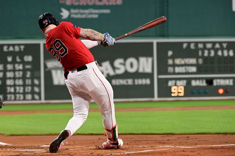 Sep 14, 2023; Boston, Massachusetts, USA; Boston Red Sox right fielder Alex Verdugo (99)  hits an RBI against the New York Yankees during the first inning at Fenway Park. Mandatory Credit: Eric Canha-USA TODAY Sports