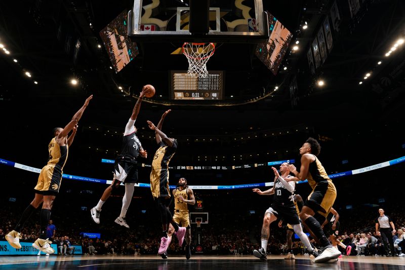 TORONTO, CANADA - JANUARY 26: Norman Powell #24 of the LA Clippers drives to the basket during the game against the Toronto Raptors on January 26, 2024 at the Scotiabank Arena in Toronto, Ontario, Canada.  NOTE TO USER: User expressly acknowledges and agrees that, by downloading and or using this Photograph, user is consenting to the terms and conditions of the Getty Images License Agreement.  Mandatory Copyright Notice: Copyright 2024 NBAE (Photo by Mark Blinch/NBAE via Getty Images)