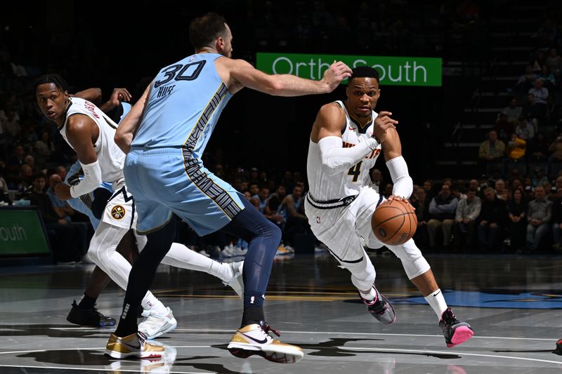 MEMPHIS, TN - NOVEMBER 19: Russell Westbrook #4 of the Denver Nuggets drives to the basket during the game against the Memphis Grizzlies during the Emirates NBA Cup game on November 19, 2024 at FedExForum in Memphis, Tennessee. NOTE TO USER: User expressly acknowledges and agrees that, by downloading and or using this photograph, User is consenting to the terms and conditions of the Getty Images License Agreement. Mandatory Copyright Notice: Copyright 2024 NBAE (Photo by Grant Burke/NBAE via Getty Images)