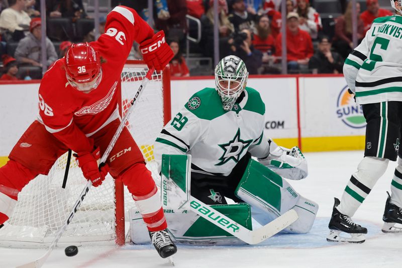 Jan 23, 2024; Detroit, Michigan, USA;  Detroit Red Wings right wing Christian Fischer (36) skates with the puck in front of Dallas Stars goaltender Jake Oettinger (29) in the second period at Little Caesars Arena. Mandatory Credit: Rick Osentoski-USA TODAY Sports