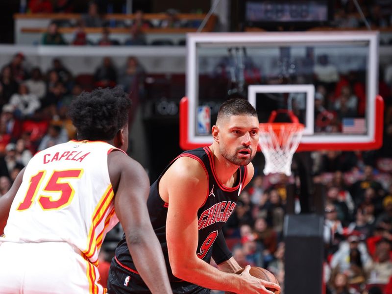 CHICAGO, IL - NOVEMBER 22: Nikola Vucevic #9 of the Chicago Bulls looks to pass the ball during the game against the Atlanta Hawks during the Emirates NBA Cup game on November 22, 2024 at United Center in Chicago, Illinois. NOTE TO USER: User expressly acknowledges and agrees that, by downloading and or using this photograph, User is consenting to the terms and conditions of the Getty Images License Agreement. Mandatory Copyright Notice: Copyright 2024 NBAE (Photo by Jeff Haynes/NBAE via Getty Images)