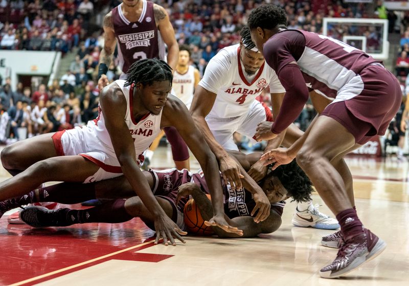 Jan 25, 2023; Tuscaloosa, Alabama, USA; Mississippi State Bulldogs forward Will McNair Jr. (13) and Alabama Crimson Tide center Charles Bediako (14) struggle for the ball during the first half at Coleman Coliseum. Mandatory Credit: Marvin Gentry-USA TODAY Sports