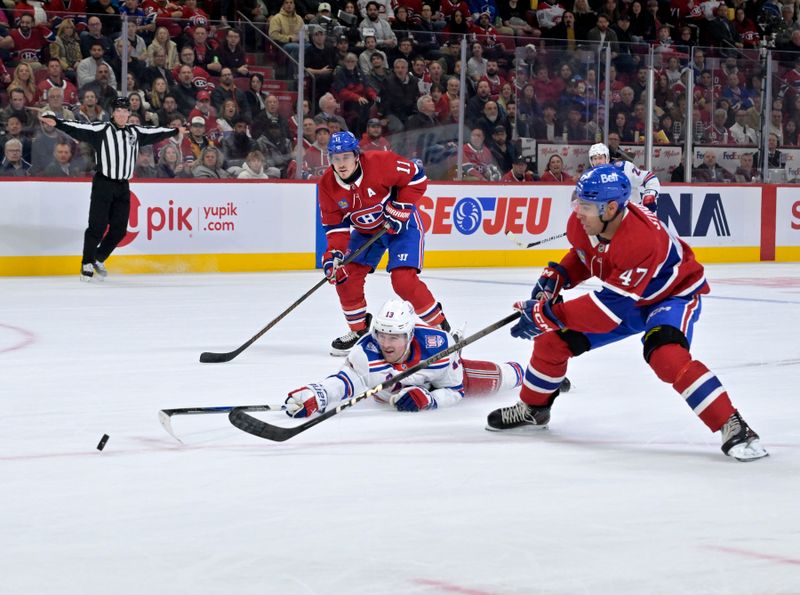 Oct 18, 2025; Montreal, Quebec, CAN; New York Rangers forward Alexis Lafreniere (13) attempts to break up the play between Montreal Canadiens defenseman Jayden Struble (47) and teammate forward Brendan Gallagher (11) during the second period at the Bell Centre. Mandatory Credit: Eric Bolte-Imagn Images