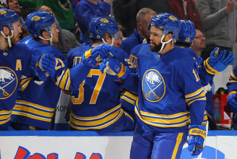 Mar 9, 2023; Buffalo, New York, USA;  Buffalo Sabres left wing Jordan Greenway (12) celebrates his goal with teammates during the first period against the Dallas Stars at KeyBank Center. Mandatory Credit: Timothy T. Ludwig-USA TODAY Sports