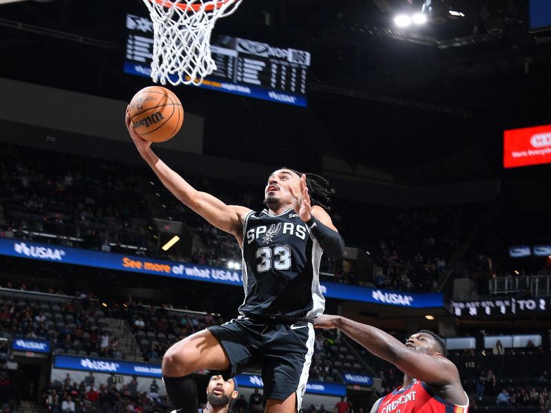 SAN ANTONIO, TX - FEBRUARY 2:  Tre Jones #33 of the San Antonio Spurs drives to the basket during the game against the New Orleans Pelicans on February 2, 2024 at the Frost Bank Center in San Antonio, Texas. NOTE TO USER: User expressly acknowledges and agrees that, by downloading and or using this photograph, user is consenting to the terms and conditions of the Getty Images License Agreement. Mandatory Copyright Notice: Copyright 2024 NBAE (Photos by Michael Gonzales/NBAE via Getty Images)