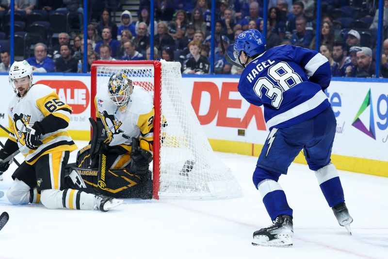 Dec 4, 2025; Tampa, Florida, USA; Tampa Bay Lightning left wing Brandon Hagel (38) shoots the puck against Pittsburgh Penguins goaltender Tristan Jarry (35) in the third period at Benchmark International Arena. Mandatory Credit: Nathan Ray Seebeck-Imagn Images