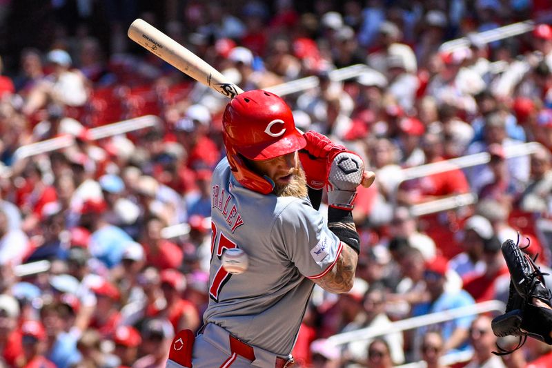 Jun 29, 2024; St. Louis, Missouri, USA; Cincinnati Reds outfielder Jake Fraley (27) is hit by a pitch from St. Louis Cardinals pitcher Sonny Gray (54) during the fifth inning at Busch Stadium. Mandatory Credit: Jeff Le-USA TODAY Sports