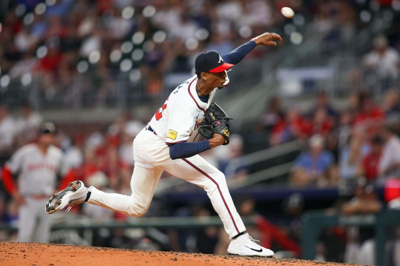 May 8, 2024; Atlanta, Georgia, USA; Atlanta Braves relief pitcher Ray Kerr (58) against the Boston Red Sox in the ninth inning at Truist Park. Mandatory Credit: Brett Davis-USA TODAY Sports
