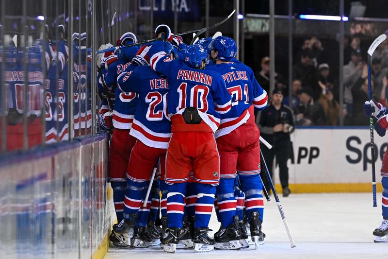 Feb 5, 2024; New York, New York, USA;  New York Rangers celebrate the 2-1 victory over Colorado Avalanche after the overtime period at Madison Square Garden. Mandatory Credit: Dennis Schneidler-USA TODAY Sports