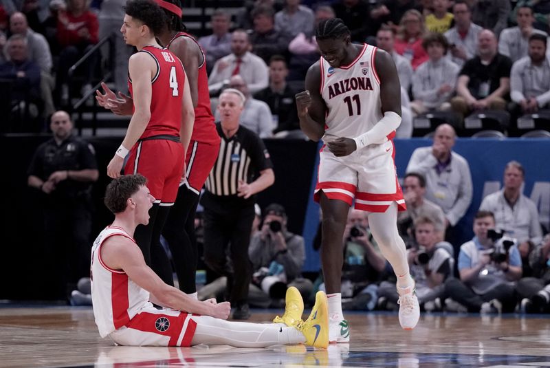 Mar 23, 2024; Salt Lake City, UT, USA; Arizona Wildcats guard Pelle Larsson (3) and Arizona Wildcats center Oumar Ballo (11) react after a foul during the second half in the second round of the 2024 NCAA Tournament at Vivint Smart Home Arena-Delta Center. Mandatory Credit: Gabriel Mayberry-USA TODAY Sports