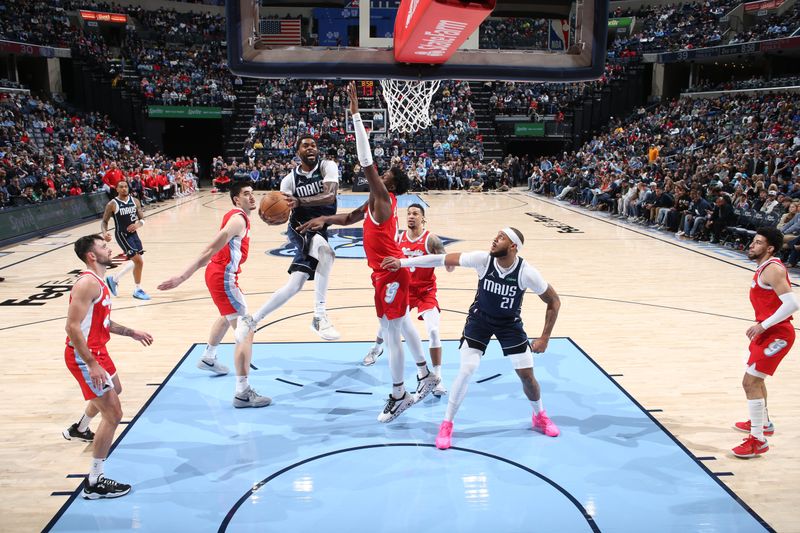 MEMPHIS, TN - JANUARY 6:  Naji Marshall #13 of the Dallas Mavericks drives to the basket during the game against the Memphis Grizzlies  on January  6, 2024 at FedExForum in Memphis, Tennessee. NOTE TO USER: User expressly acknowledges and agrees that, by downloading and or using this photograph, User is consenting to the terms and conditions of the Getty Images License Agreement. Mandatory Copyright Notice: Copyright 2024 NBAE (Photo by Joe Murphy/NBAE via Getty Images)