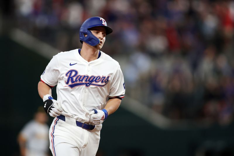 Aug 19, 2024; Arlington, Texas, USA; Texas Rangers shortstop Corey Seager (5) rounds the bases after hitting a home run against the Pittsburgh Pirates in the first inning at Globe Life Field. Mandatory Credit: Tim Heitman-USA TODAY Sports