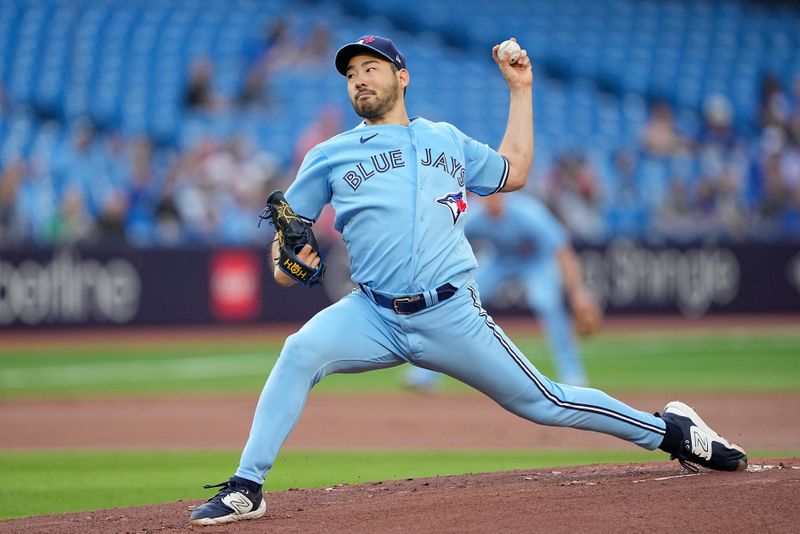 May 30, 2023; Toronto, Ontario, CAN; Toronto Blue Jays starting pitcher Yusei Kikuchi (16) pitches to the Milwaukee Brewers during the first inning at Rogers Centre. Mandatory Credit: John E. Sokolowski-USA TODAY Sports