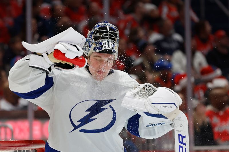 Dec 23, 2023; Washington, District of Columbia, USA; Tampa Bay Lightning goaltender Andrei Vasilevskiy (88) squirts his face with water during a timeout against the Washington Capitals in the third period at Capital One Arena. Mandatory Credit: Geoff Burke-USA TODAY Sports