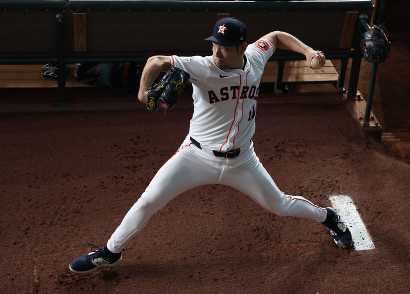 Sep 19, 2024; Houston, Texas, USA; Houston Astros starting pitcher Yusei Kikuchi (16) warms up before pitching against the Los Angeles Angels at Minute Maid Park. Mandatory Credit: Thomas Shea-Imagn Images