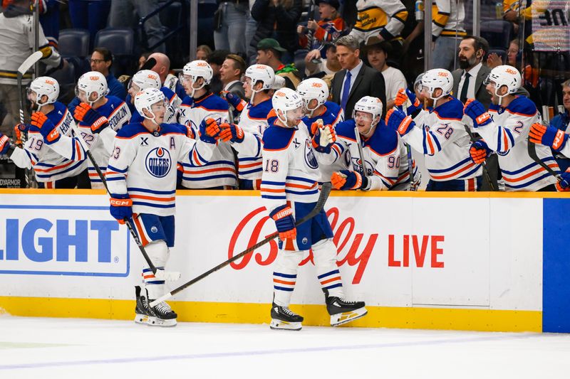 Oct 31, 2024; Nashville, Tennessee, USA;  Edmonton Oilers left wing Zach Hyman (18) celebrates his goal with his teammates  against the Nashville Predators during the third period at Bridgestone Arena. Mandatory Credit: Steve Roberts-Imagn Images