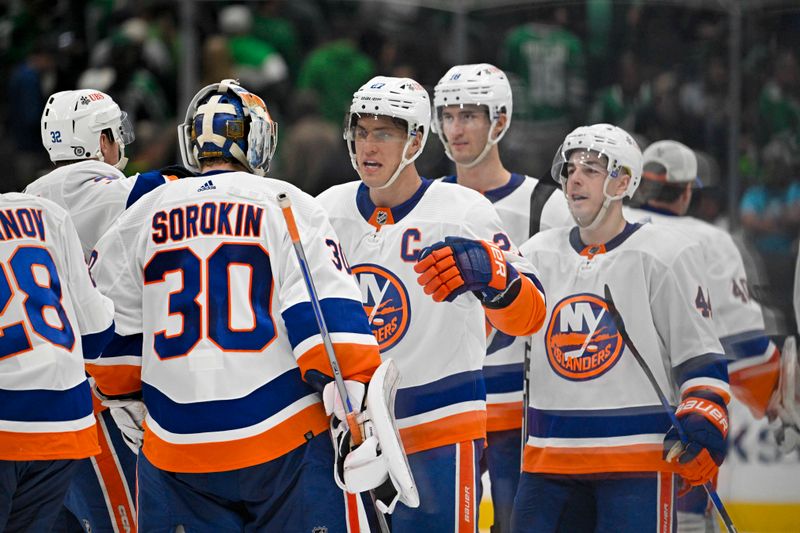 Feb 26, 2024; Dallas, Texas, USA; New York Islanders goaltender Ilya Sorokin (30) and left wing Anders Lee (27) and left wing Pierre Engvall (18) celebrate after the Islanders defeat the Dallas Stars in overtime at the American Airlines Center. Mandatory Credit: Jerome Miron-USA TODAY Sports