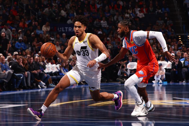 OKLAHOMA CITY, OK - DECEMBER 3: Johnny Juzang #33 of the Utah Jazz drives to the basket during the game against the Oklahoma City Thunder during the Emirates NBA Cup game on on December 3, 2024 at Paycom Center in Oklahoma City, Oklahoma. NOTE TO USER: User expressly acknowledges and agrees that, by downloading and or using this photograph, User is consenting to the terms and conditions of the Getty Images License Agreement. Mandatory Copyright Notice: Copyright 2024 NBAE (Photo by Zach Beeker/NBAE via Getty Images)