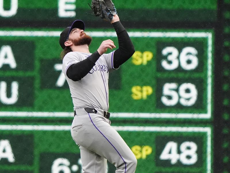                   May 4, 2024; Pittsburgh, Pennsylvania, USA; Colorado Rockies second baseman Brendan Rodgers (7) catches a fly ball hit by Pittsburgh Pirates right fielder Bryan Reynolds (not pictured) during the sixth inning at PNC Park. Mandatory Credit: Gregory Fisher-USA TODAY Sports