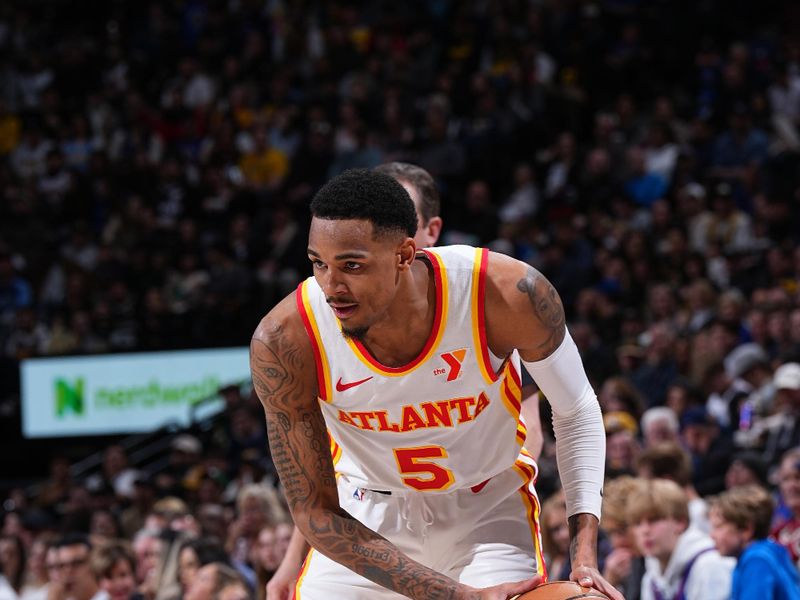 DENVER, CO - APRIL 6: Dejounte Murray #5 of the Atlanta Hawks dribbles the ball during the game against the Denver Nuggets on April 6, 2024 at the Ball Arena in Denver, Colorado. NOTE TO USER: User expressly acknowledges and agrees that, by downloading and/or using this Photograph, user is consenting to the terms and conditions of the Getty Images License Agreement. Mandatory Copyright Notice: Copyright 2024 NBAE (Photo by Garrett Ellwood/NBAE via Getty Images)