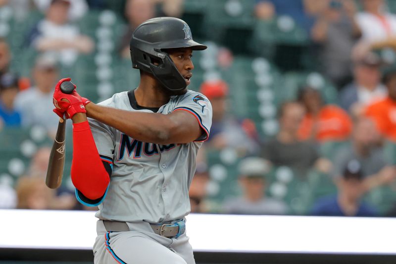 May 13, 2024; Detroit, Michigan, USA;  Miami Marlins outfielder Jesus Sanchez (12) hits an RBI single in the fifth inning against the Detroit Tigers at Comerica Park. Mandatory Credit: Rick Osentoski-USA TODAY Sports