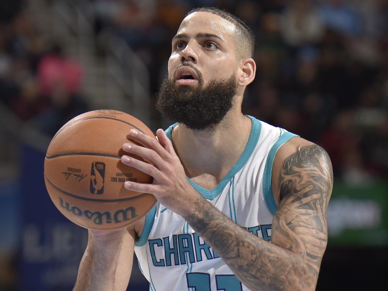 CLEVELAND, OH - NOVEMBER 17: Cody Martin #11 of the Charlotte Hornets shoots a free throw during the game against the Cleveland Cavaliers on November 17, 2024 at Rocket Mortgage FieldHouse in Cleveland, Ohio. NOTE TO USER: User expressly acknowledges and agrees that, by downloading and/or using this Photograph, user is consenting to the terms and conditions of the Getty Images License Agreement. Mandatory Copyright Notice: Copyright 2024 NBAE (Photo by David Liam Kyle/NBAE via Getty Images)