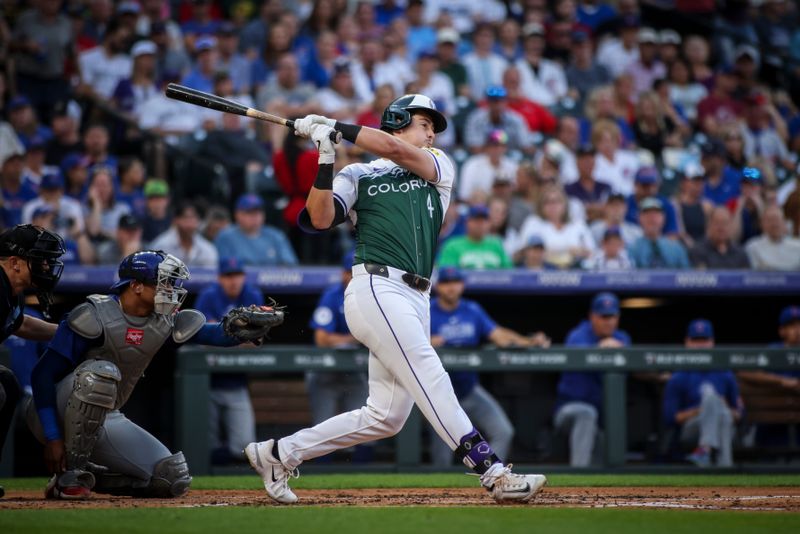 Sep 14, 2024; Denver, Colorado, USA; Colorado Rockies first base Michael Toglia (4) bats during the second inning against the Chicago Cubs at Coors Field. Mandatory Credit: Chet Strange-Imagn Images