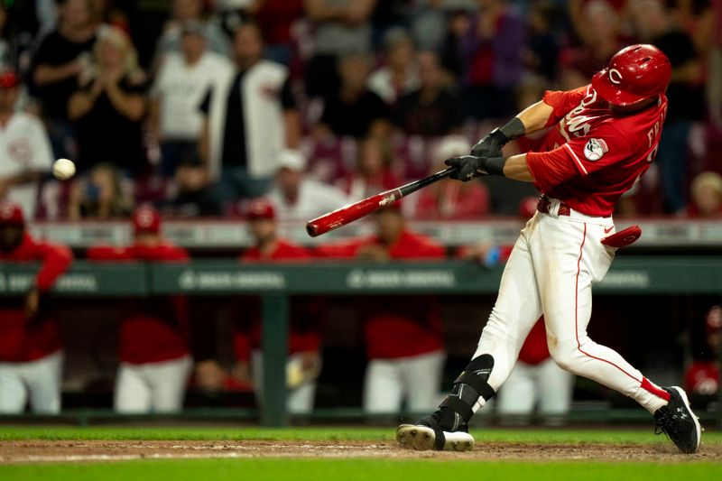 Sep 23, 2023; Cincinnati, Ohio, USA; Cincinnati Reds center fielder TJ Friedl (29) hits a double in the ninth inning against the Pittsburgh Pirates at Great American Ball Park. Mandatory Credit: The Cincinnati Enquirer-USA TODAY Sports