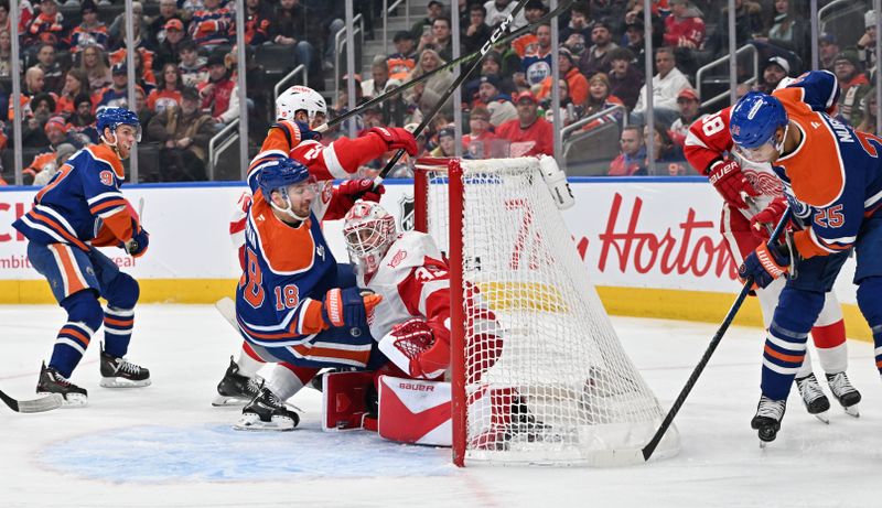 Dec 11, 2025; Edmonton, Alberta, CAN; Edmonton Oilers center Connor McDavid (97) watches as Edmonton Oilers left winger Zach Hyman (18) crashes into Detroit Red Wings goalie Cam Talbot (39) during the third period at Rogers Place. Mandatory Credit: Walter Tychnowicz-Imagn Images