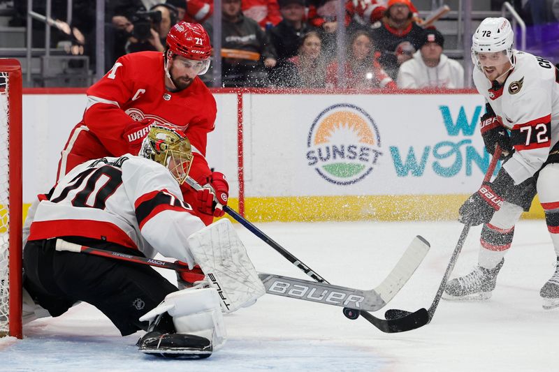 Jan 31, 2024; Detroit, Michigan, USA;  Ottawa Senators goaltender Joonas Korpisalo (70) makes a save on Detroit Red Wings center Dylan Larkin (71) in the second period at Little Caesars Arena. Mandatory Credit: Rick Osentoski-USA TODAY Sports