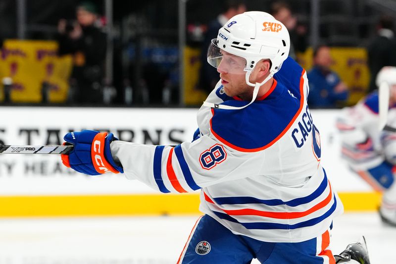 Dec 3, 2024; Las Vegas, Nevada, USA; Edmonton Oilers left wing Drake Caggiula (8) warms up before a game against the Vegas Golden Knights at T-Mobile Arena. Mandatory Credit: Stephen R. Sylvanie-Imagn Images