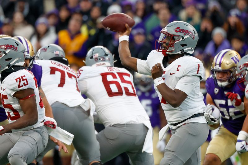 Nov 25, 2023; Seattle, Washington, USA; Washington State Cougars quarterback Cameron Ward (1) passes against the Washington Huskies during the fourth quarter at Alaska Airlines Field at Husky Stadium. Mandatory Credit: Joe Nicholson-USA TODAY Sports